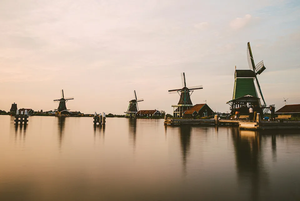 Dutch windmills by a lake
